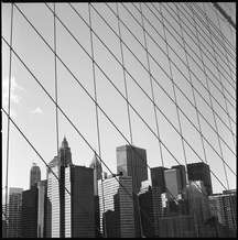 Downtown Manhattan viewed through and from the Brooklyn Bridge